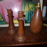 A pair of oak candlesticks together with a tear drop shaped oak lamp (3)
