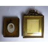 A portrait miniature of a young child in an oval frame, contained within a Jarrolo & Co.