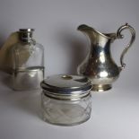 A dressing table jar with hallmarked silver lid together with a hip flask with a silver lid and a