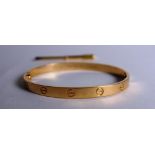 An 18ct rose gold Cartier 'Love' bangle, decorated with screwhead motifs,