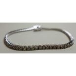 An 18ct white gold ladies bracelet inset with 2.