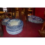 A collection of 19th century blue and white including meat platters and Burslem and Milton Delft