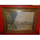 An oil on board, country landscape, in a carved giltwood frame