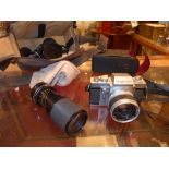 A Topcon RE Super camera together with a