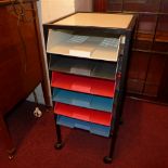 A retro metal filing chest of six trays