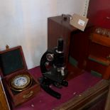 A teak cased ship's compass together with a c1940's Coke Tronghton and Simms Ltd cased microscope