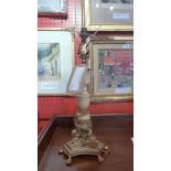 A 19th century alabaster and gilt metal table lamp having ornate Classical style relief.