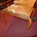 A walnut low table with mirrored top raised on cabriole supports.