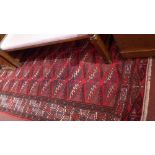 A fine north east Persian Yamut carpet bearing a design of interlocking geometric motifs in a