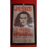 A framed 'Jesus Lives on Broadway' poster, with signatures.