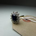 A ladies 18ct gold, sapphire, and diamond ring.