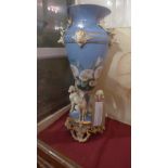 A 19th Century porcelain vase glazed blue with floral reserves and decorated with moulded stags and