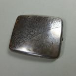 A hallmarked sterling silver cigarette case assayed in Birmingham,