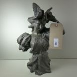 A Spelter bust of a lady wearing a winged hat, signed 'Jouetay'.