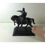 A bronzed maquette of a Russian bronze figure on horseback.