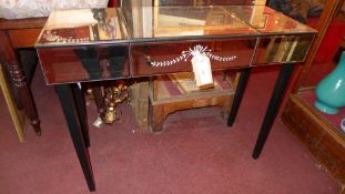 A Venetian style mirrored glass console