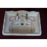 An Edwardian porcelain sink with hand-pa