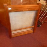 A teak wall hanging display unit with a