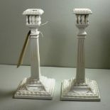 SOLD IN TIMED AUCTION A pair of 19th century Worcester blanc de chine candlesticks in the Adam