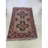 An antique handmade Heriz carpet,