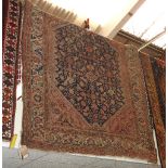 An antique handmade Persian Malayer carpet,