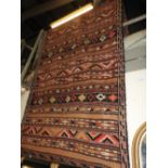 An antique Kelleh kilim runner of repeating geometric designs on polychromatic parallel bands,