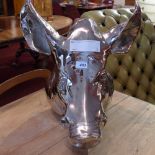 A chromed metal wall mounting pigs head.