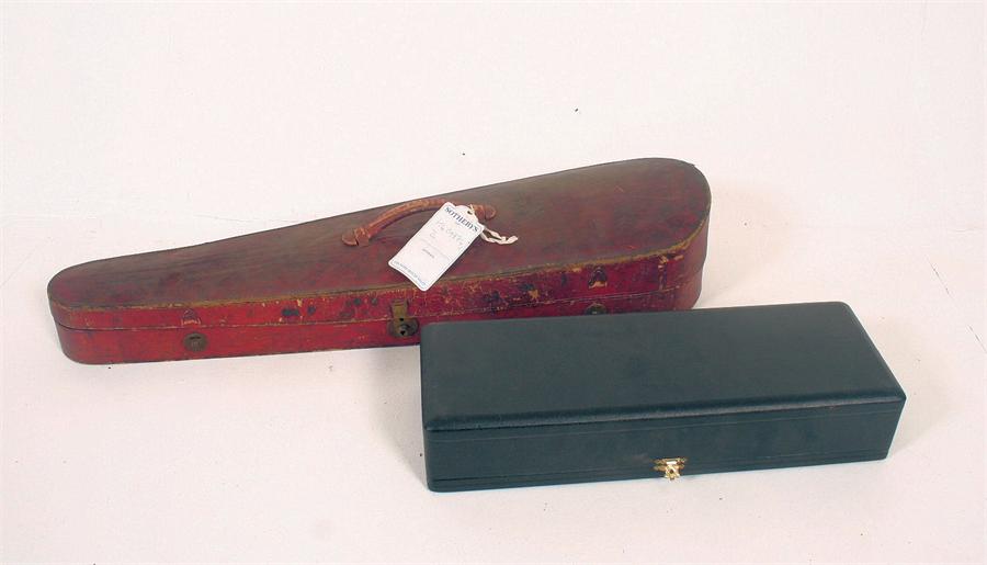 A red leather violin case (length 78cm) together with a music stand and a musical instrument case (