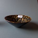 A Chinese Stoneware bowl decorated with a mottled tortoiseshell type glaze