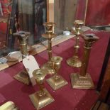 Three pairs of brass candlesticks of various styles