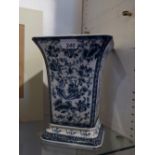 A splayed-top blue and white vase decorated with flowers and birds,
