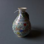 A Chinese porcelain vase decorated in the Doucai palette decorated with phoenixes and flowers,