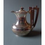 A hallmarked silver coffee pot