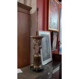 A large Classical style twin handled urn form table lamp raised on a marble base.