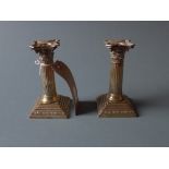 A pair of Victorian hallmarked silver Corinthium column form candlesticks