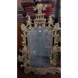 A pair of 18th century style carved giltwood wall mirror the 19th century mirrors plates within