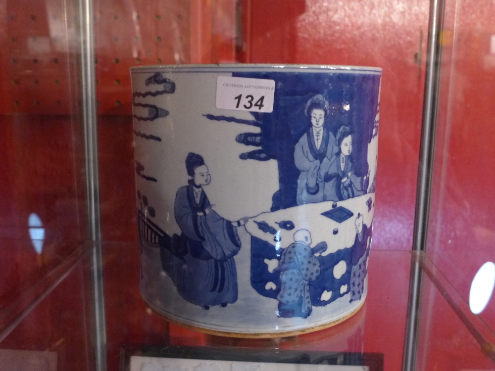 A Chinese blue and white jardiniere decorated with social scenes