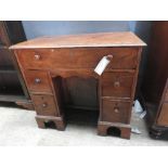 An early 19th century George III mahogany secretaire kneehole desk,