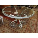 A circular duck egg blue conservatory table with glass top