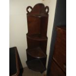 A late 19th century Gothic style oak whatnot