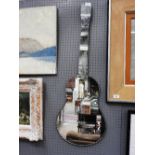A 1950s guitar mirror with bevelled detail