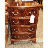 A Georgian style mahogany bowfront bedside chest of four drawers and a Persian style runner