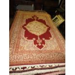 An Indian Kashmir rug, the central medallion on rouge ground,