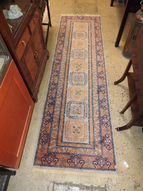 A Persian style hand knotted runner