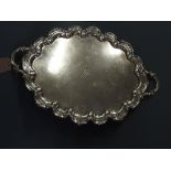 A large twin handled silver tray,