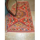An Anatolian Kilim carpet of repeating geometric design, along with a qashquai carpet,