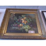 An oil on canvas still life study depicting a bowl of fruit, in a gilt frame.