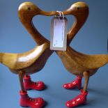 A carved pair of novelty model ducks