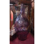 A large purple glass vase