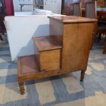 A set of Victorian mahogany library steps with tooled leather tops and two box compartments raised